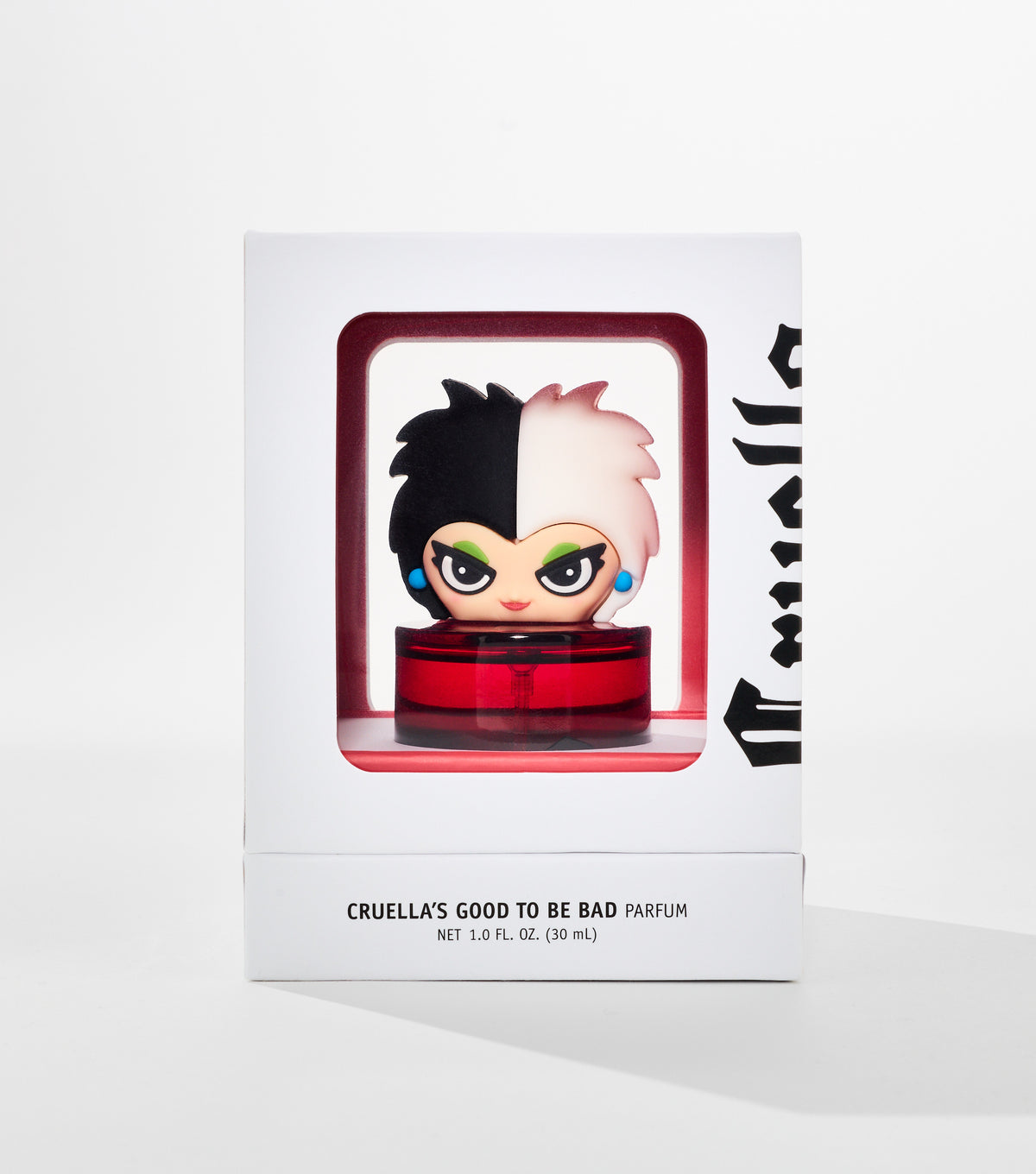 A white box with a window shows a red perfume bottle topped by a cartoon figure with half-black, half-white hair.