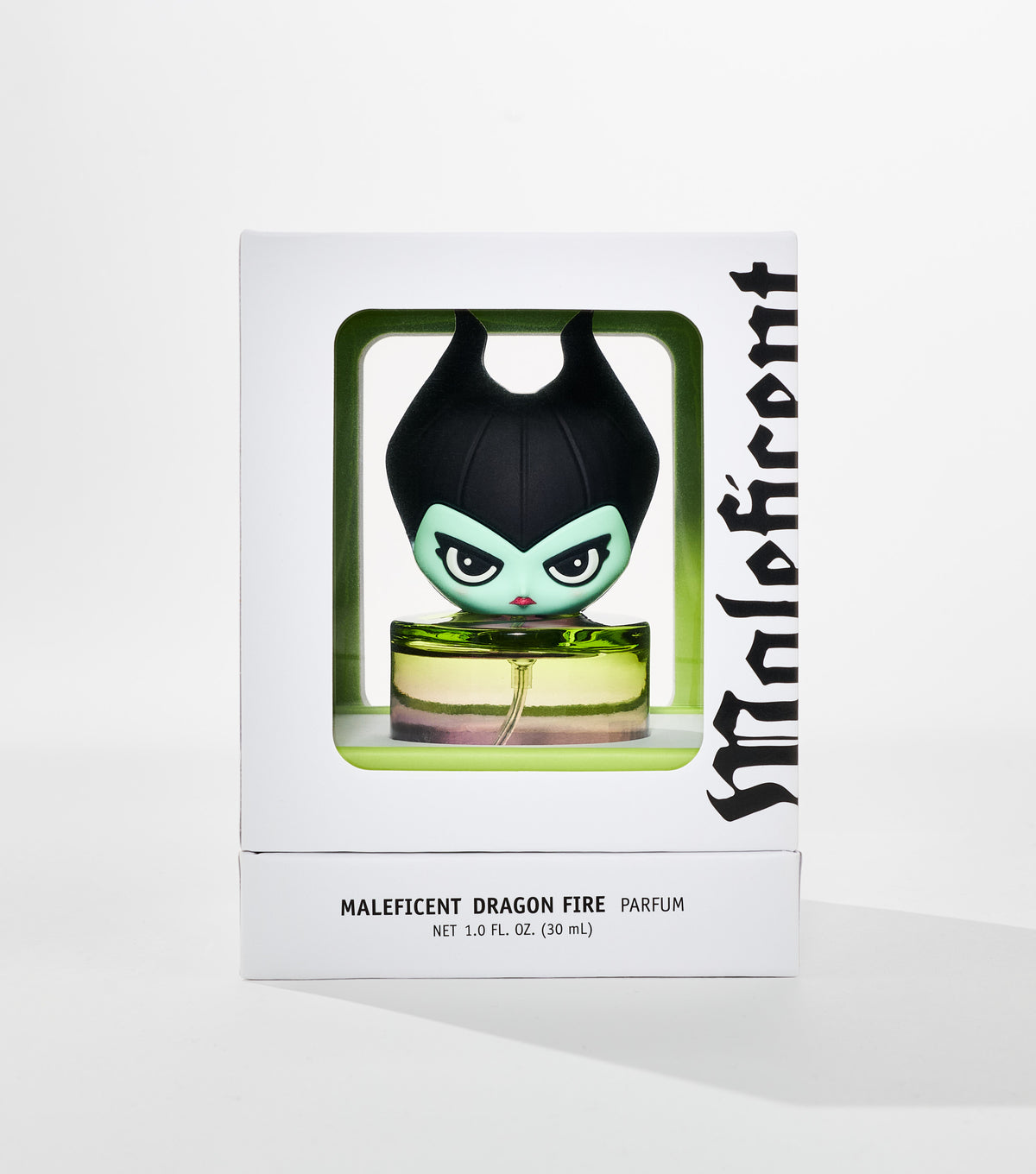 A white box with a green window shows a perfume bottle topped by a horned, green-faced cartoon character cap.