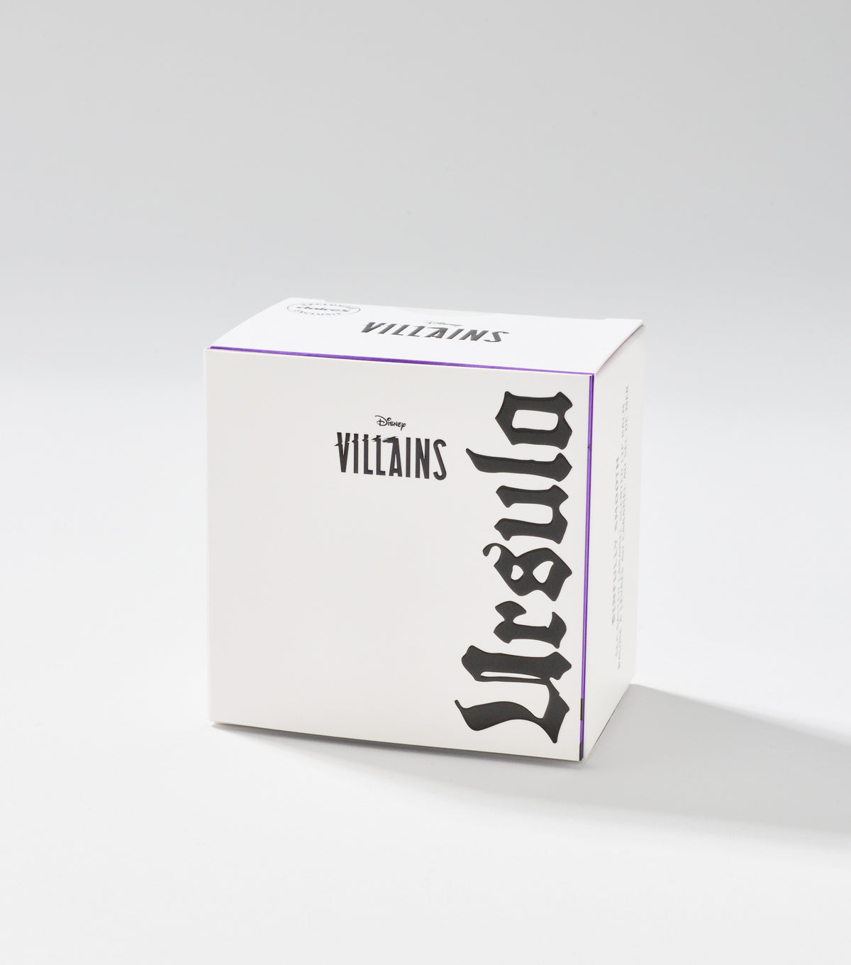 A white square product box with purple edge trim, black Disney Villains lettering, and the name Ursula in large gothic script.