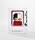 A white box with a window shows a red perfume bottle topped by a cartoon figure with half-black, half-white hair.