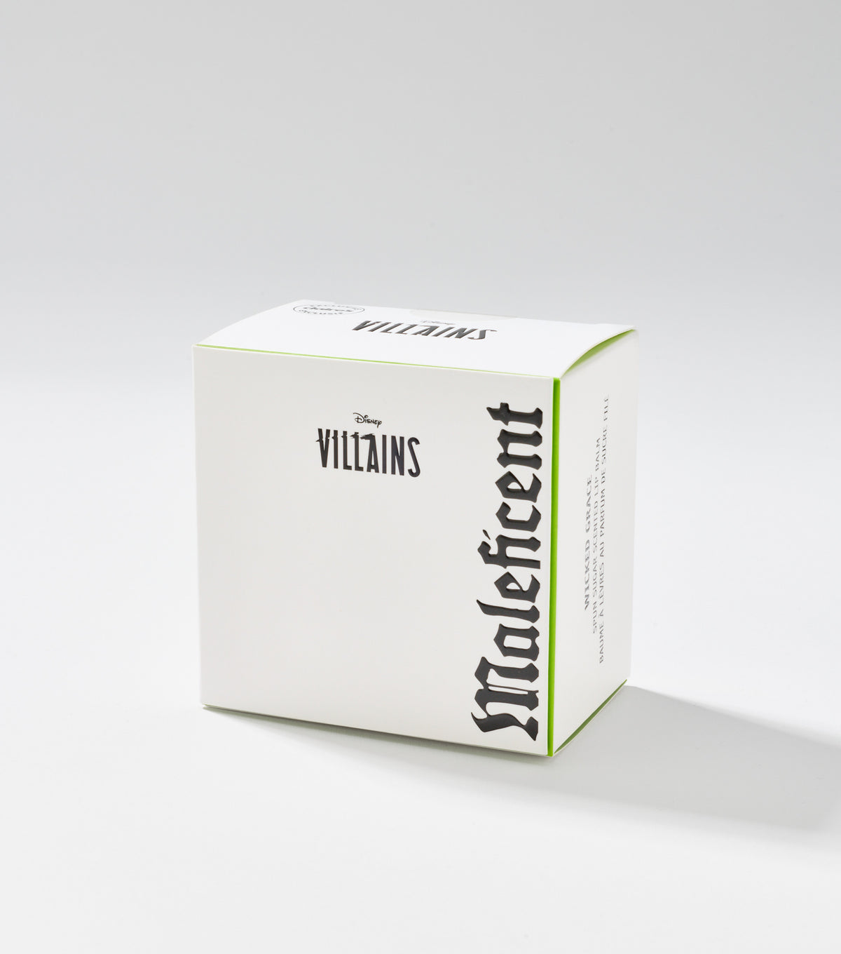 A white square product box with green edges, printed with Disney Villains and Maleficent in black gothic lettering, sits against a plain background.