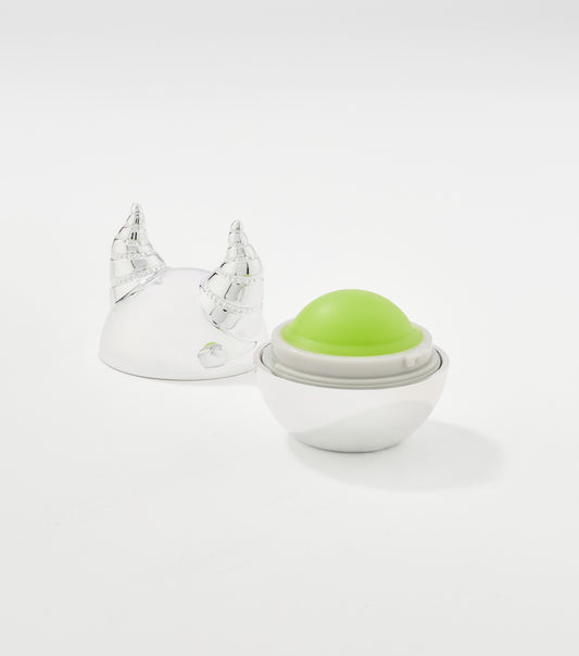 An open spherical lip balm with a green dome inside a white base, beside a silver horned lid.
