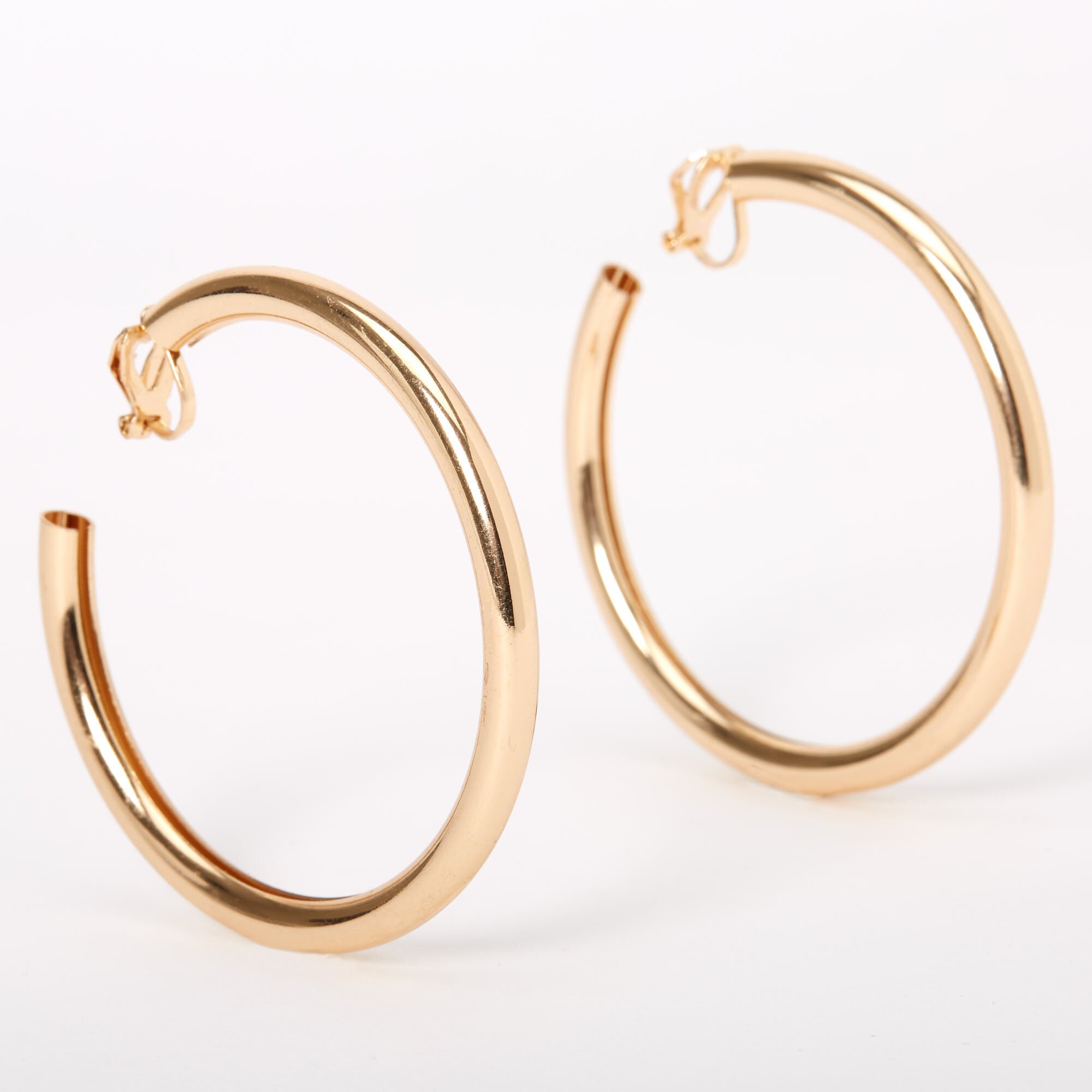 View Claires Tone 60MM Tube Clip On Hoop Earrings Gold information