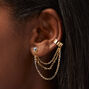 Clous d&#39;oreilles reli&eacute;s par un ornement en strass couleur dor&eacute;e,