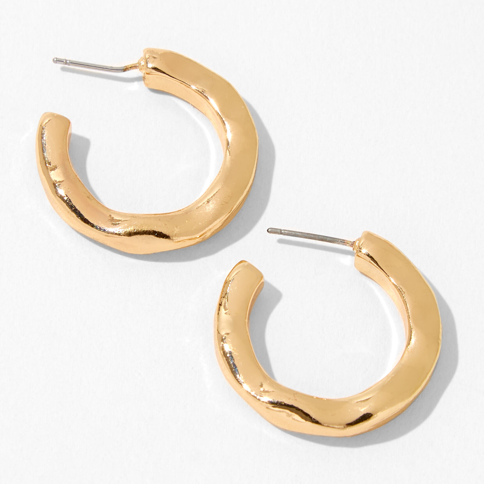 Créoles façon métal en fusion 30 mm couleur dorée,
