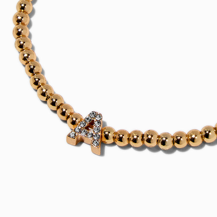 Bracelet &eacute;lastique &agrave; initiale pav&eacute; perl&eacute; couleur dor&eacute;e - A,