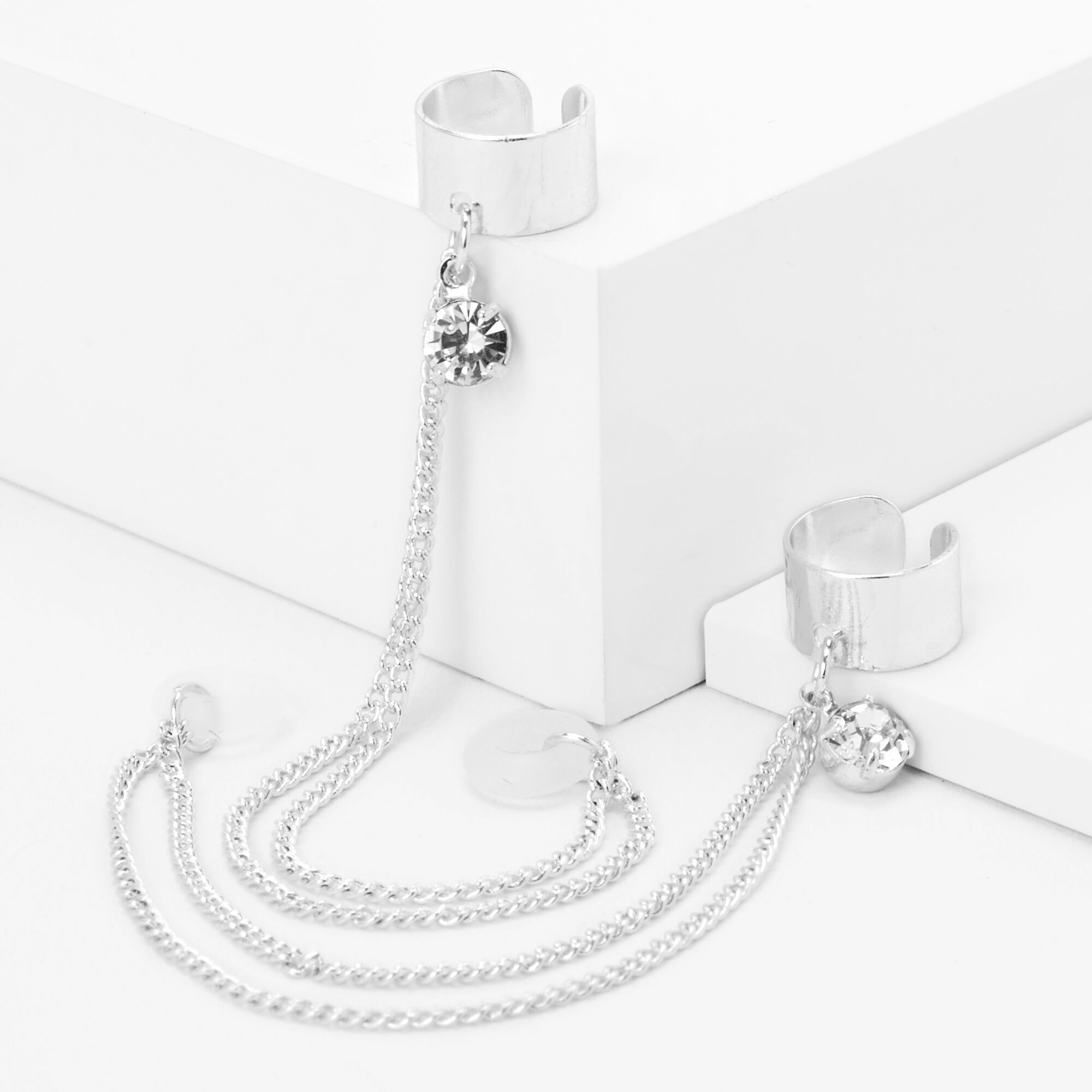 Claire's Manchettes d’oreilles breloque strass couleur argentée - Compatible avec les AirPods® de Apple