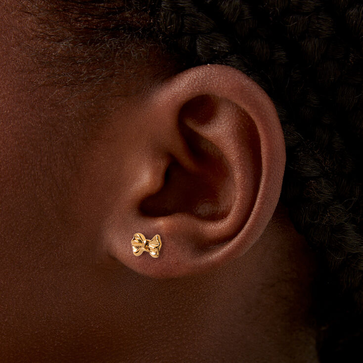 Mini clous d&#39;oreilles &agrave; n&oelig;ud couleur dor&eacute;e,