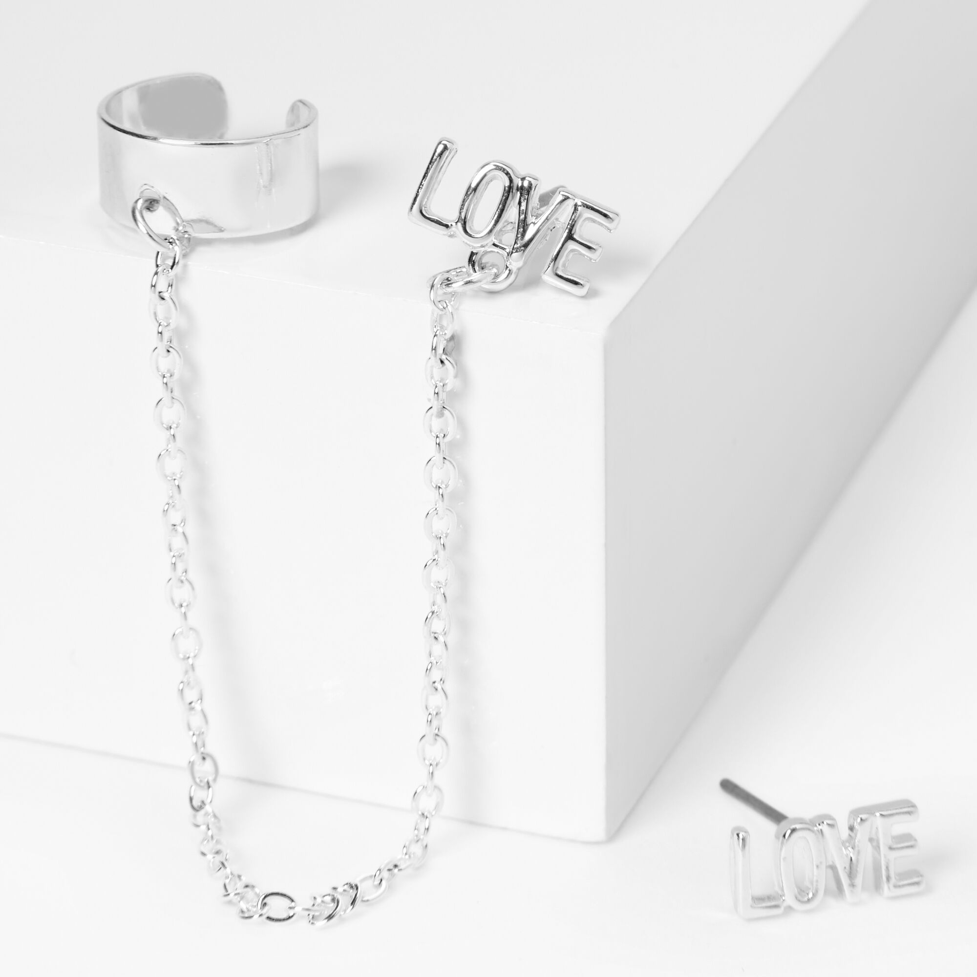 Claire's Boucles d’oreilles à chaîne avec manchette d’oreille et clou « Love » couleur argentée