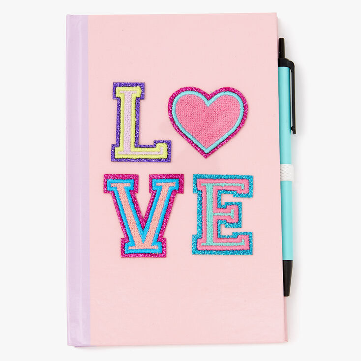 Claire's Journal intime à écussons « Love » - Rose