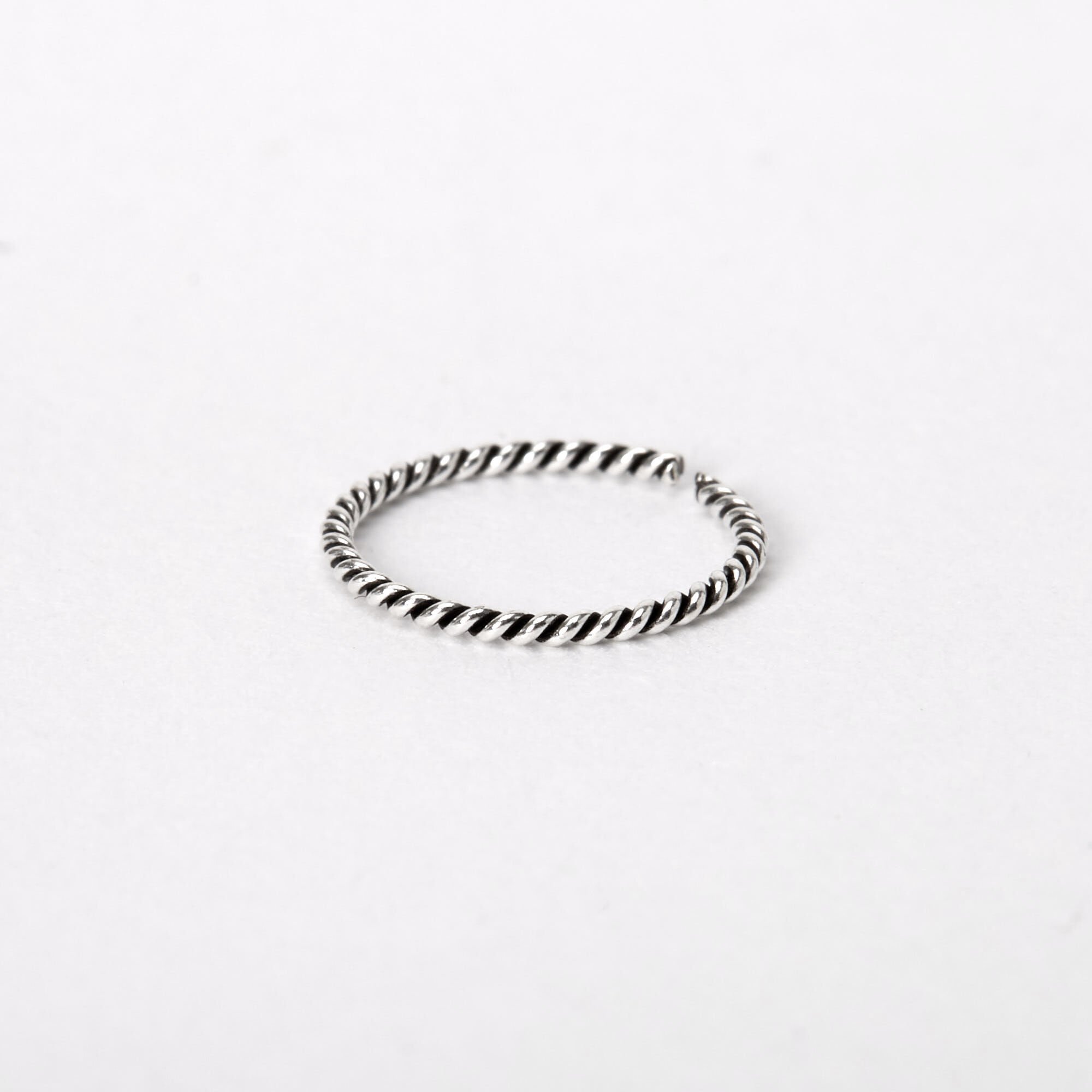 Simple silver nose outlet ring
