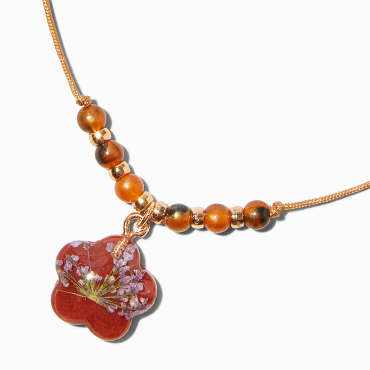 Bracelet bolo avec breloques marguerite fleur s&eacute;ch&eacute;e rouge,