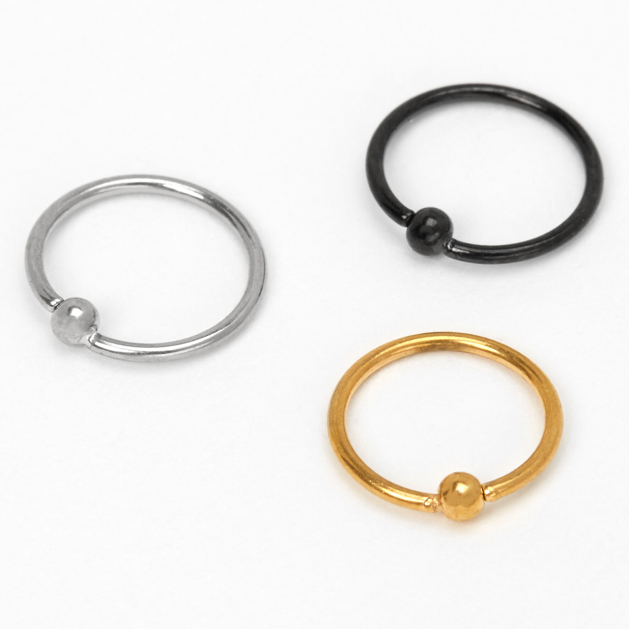 View Claires Mixed Metal Titanium 20G Ball Hoop Nose Rings 3 Pack Gold information
