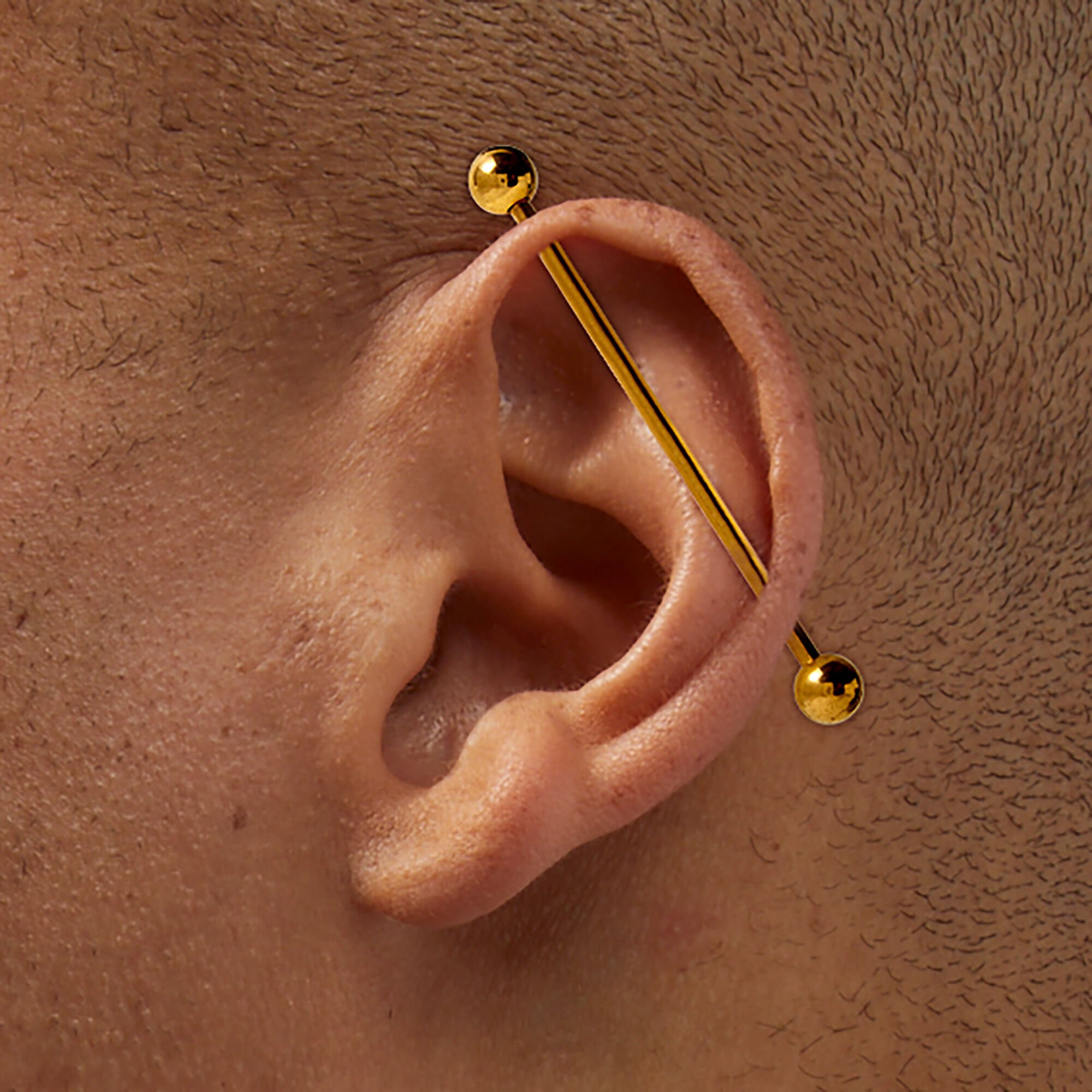 Gold tone Titanium 14G Industrial Bar Claire s US