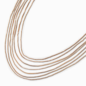 Collier &agrave; sept cha&icirc;nes couleur dor&eacute;e,