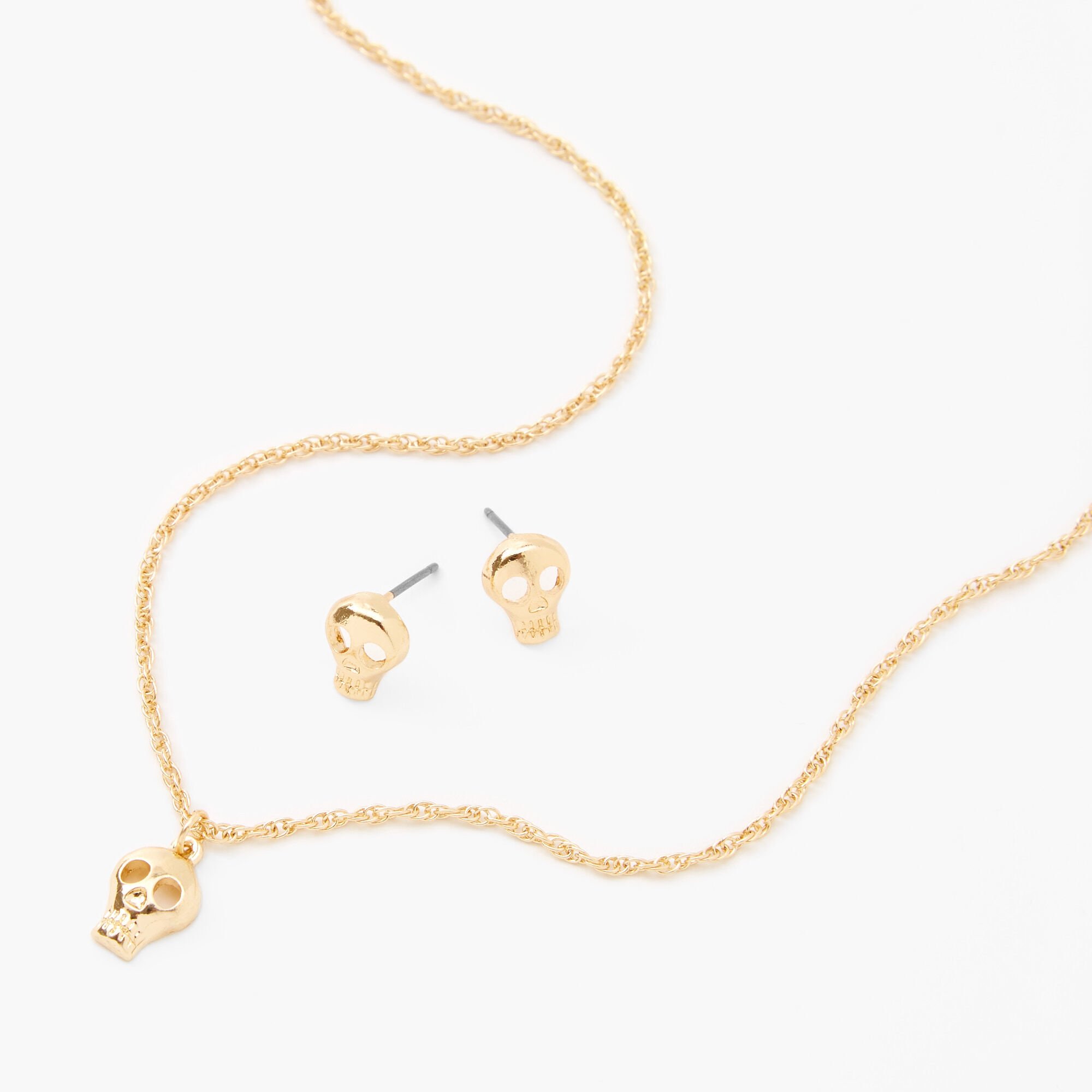 Claire's Parure de bijoux à pendentif tête de mort couleur dorée - Lot de 2