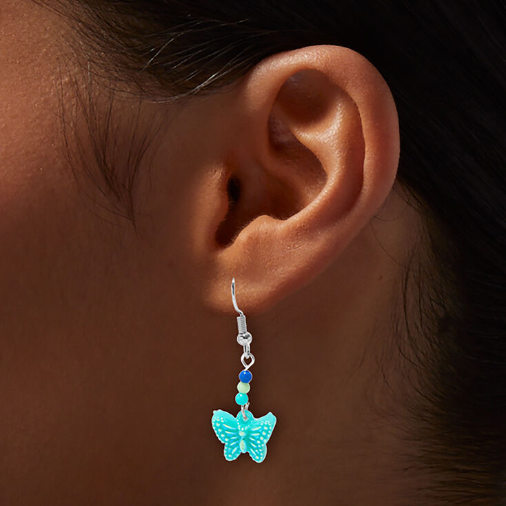 Pendantes papillons bleus phosphorescents,