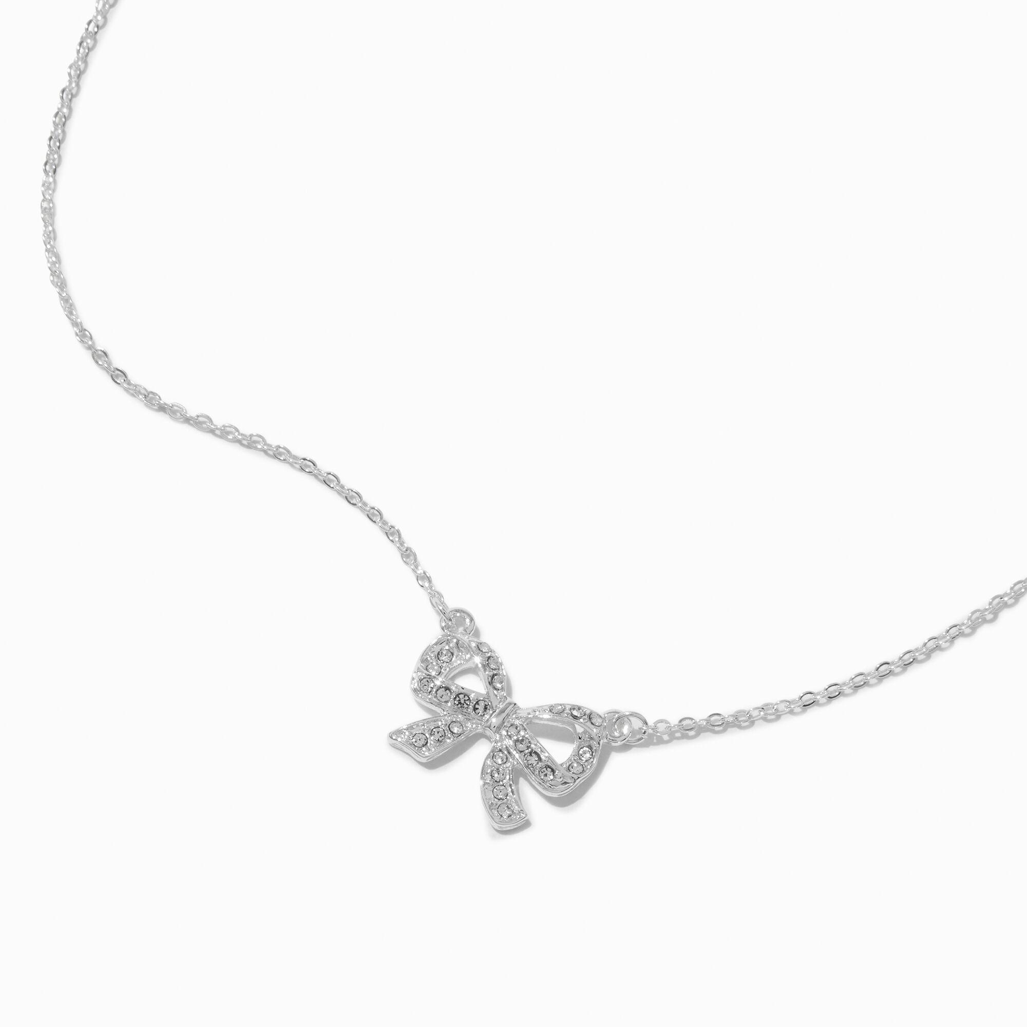 View Claires Tone Crystal Bow Pendant Necklace Silver information