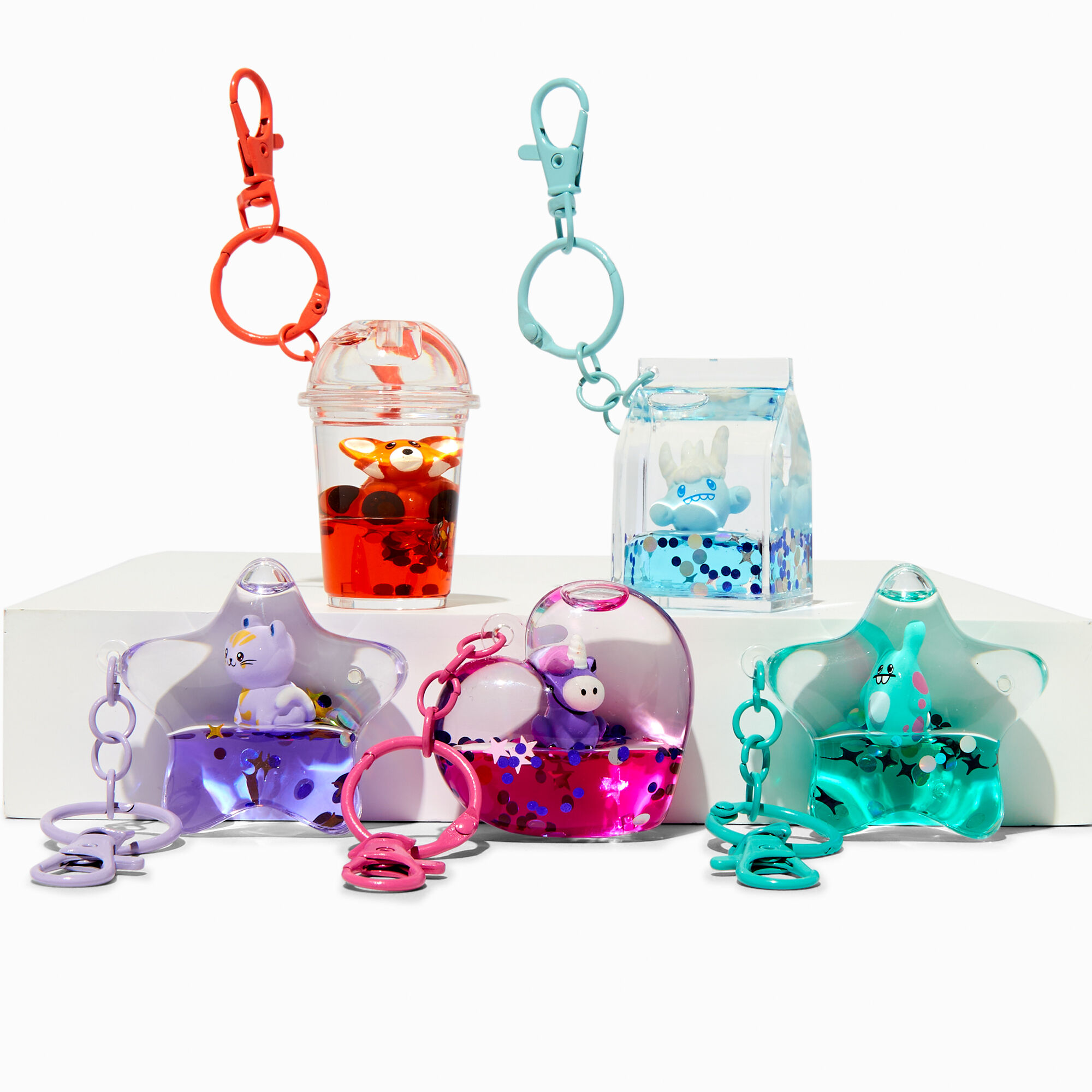 Pochette surprise porte cl s remplie d eau cr atures Claire s Shimmerville Les mod les peuvent varier