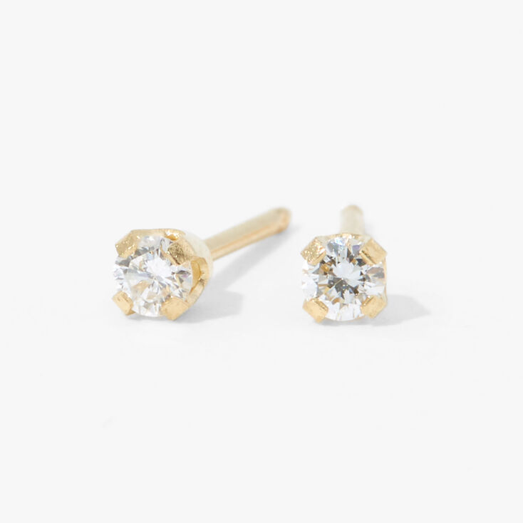 Kit de piercing d&#39;oreilles avec clous d&rsquo;oreilles orn&eacute;s d&rsquo;un diamant produit en laboratoire or jaune 9 carats avec lotion de soin,