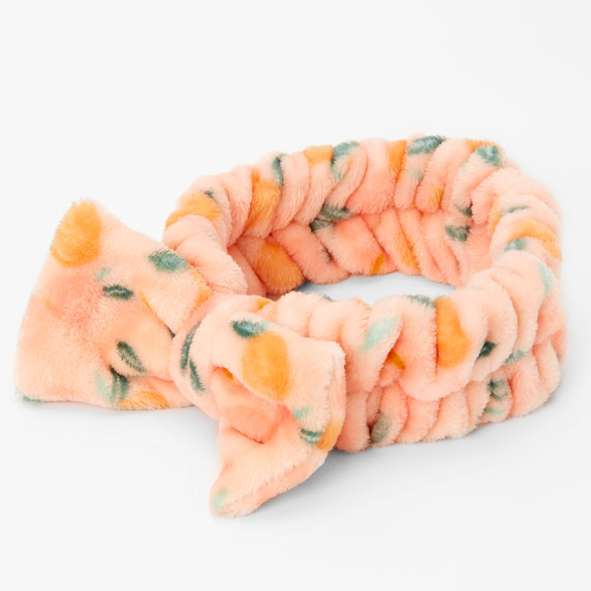 Claire's Bandeau à nœud pour le maquillage en peluche pêches